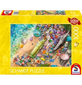 Puzzlebox mit farbenfrohem Strandszenen-Motiv, Schalen, Steinen, Flasche und Treibholz auf gelber Verpackung.