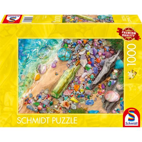Puzzlebox mit farbenfrohem Strandszenen-Motiv, Schalen, Steinen, Flasche und Treibholz auf gelber Verpackung.