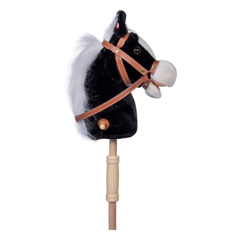 Kuscheliger schwarz-weißer Steckenpferdkopf mit Trense, befestigt auf einem Holzstab.
