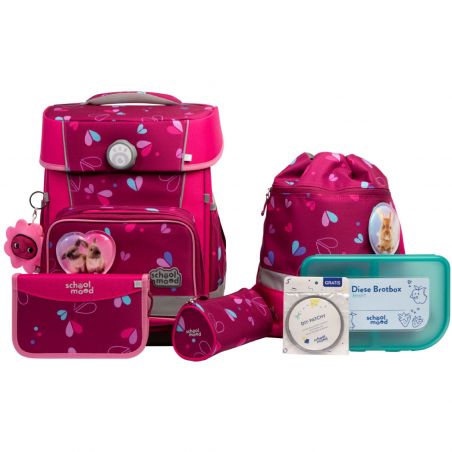 Set rosa Schulartikel mit Herzmuster: Rucksack, Etui, Brotdose und weitere Accessoires.