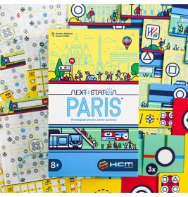 Die Schachtel von Next Station: Paris liegt auf bunten Spielkarten und Kartenblättern.