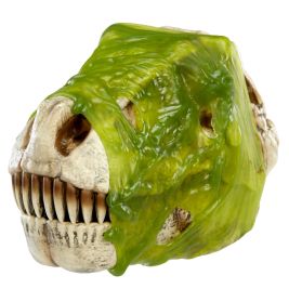 Ein Dinosaurierschädel-Spielzeug ist teilweise mit leuchtend grünem, schleimigem Glibber bedeckt.