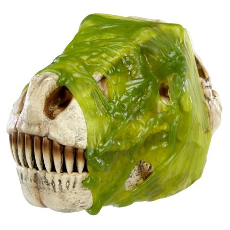 Ein Dinosaurierschädel-Spielzeug ist teilweise mit leuchtend grünem, schleimigem Glibber bedeckt.