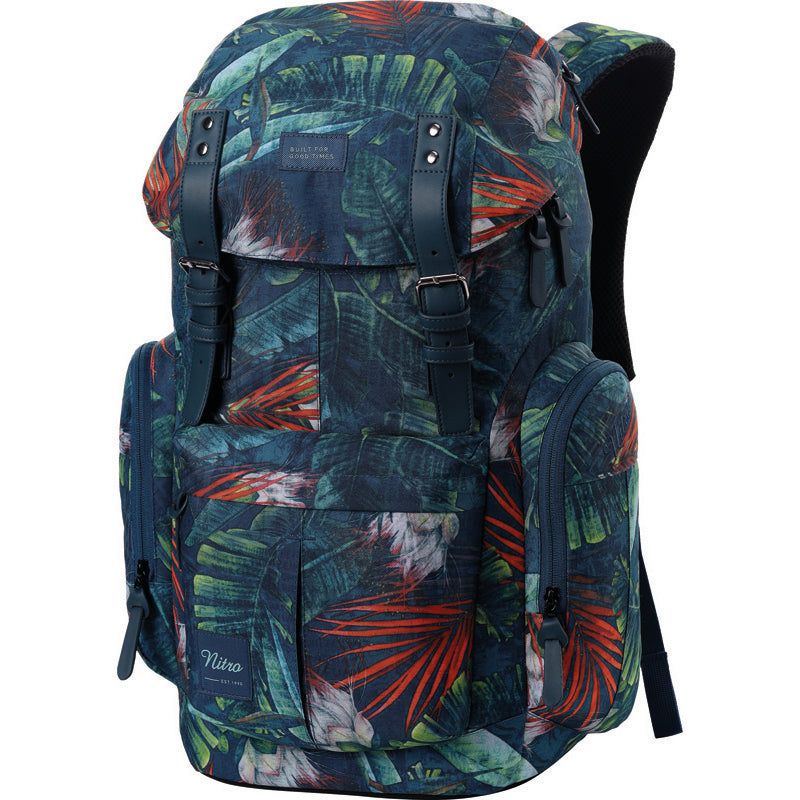 Rucksack mit tropischem Blattmuster in Grün, Rot und Orange, Fronttasche und schwarzen Trägern. Rucksack mit tropischem Blattmuster in Grün, Rot und Orange, Fronttasche und schwarzen Trägern.