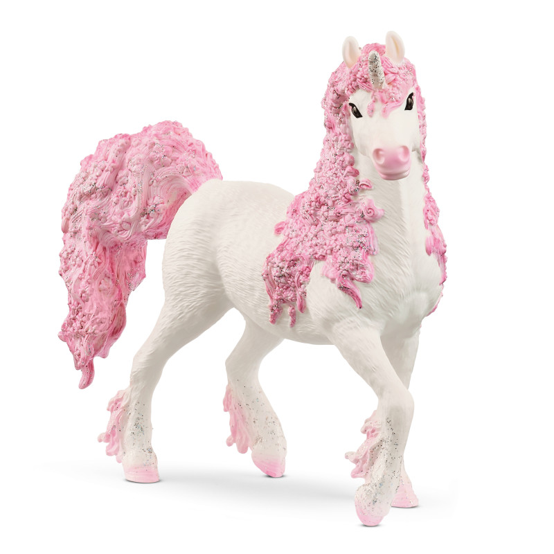 Ein weißes Spielzeug-Einhorn mit langen, lockigen, rosa Haaren, glitzernden Hufen und funkelndem Horn.
