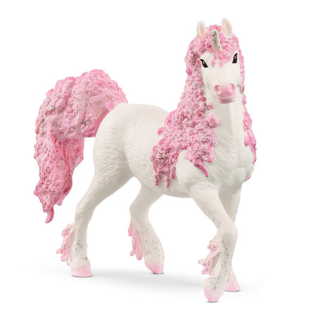 Ein weißes Spielzeug-Einhorn mit langen, lockigen, rosa Haaren, glitzernden Hufen und funkelndem Horn.