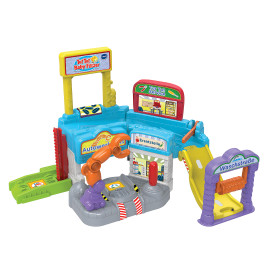 Buntes Spielzeug-Autowaschset mit Rampen, Schildern und Roboterarm für Kinder.