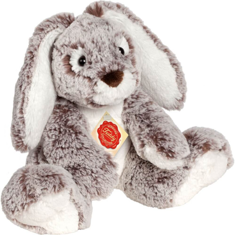 Grauer-weißes Plüschkaninchen mit Schlappohren und rotem Steiff-Original-Etikett auf der Brust.