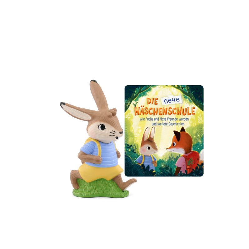 Hasenfigur im blauen Hemd und gelber Hose neben dem Buch Die neue Häschenschule.