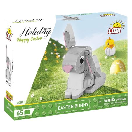Schachtel der COBI Holiday Series mit Bausteinen für einen grauen Osterhasen auf grasgrünem Hintergrund.