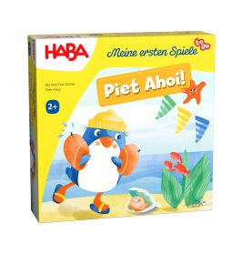Spielschachtel Piet Ahoi! von HABA mit Pinguin im gelben Hut am Strand mit Meeresmotiven.