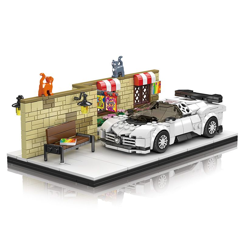 LEGO-Sportwagen in Weiß steht an einer Backsteinmauer mit zwei Katzen, einer Bank und bunten Markisen.