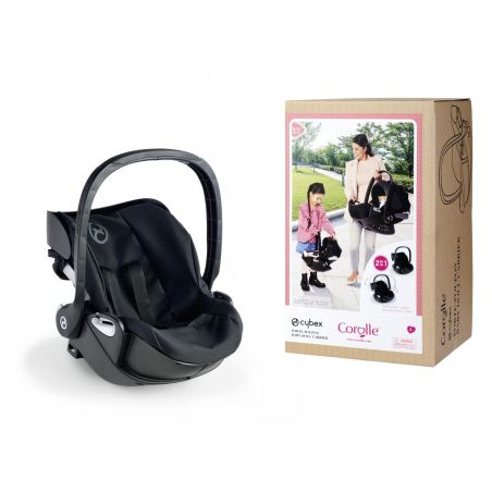 Schwarzer Kindersitz neben Karton mit Bild einer Frau und eines Kindes, die den Sitz tragen.