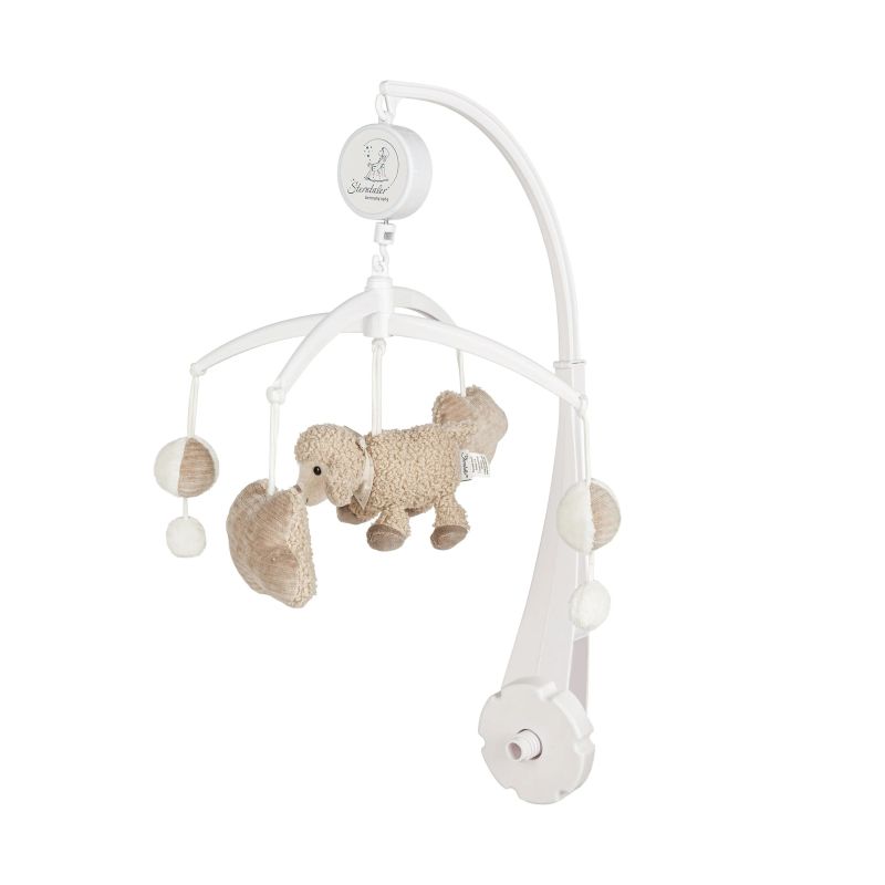 Weißes Baby-Mobil mit Plüschhund und kugelförmigen Anhängern. Weißes Baby-Mobil mit Plüschhund und kugelförmigen Anhängern.
