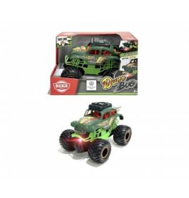 Grüner Spielzeug-Monstertruck Dragon mit sichtbarer Verpackung im Hintergrund.