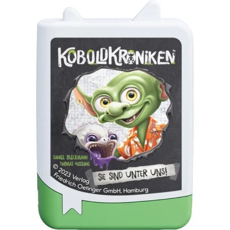 Box mit Comic-Goblin und Hund, Titel Koboldkroniken, deutschem Text, grün-weißes Design.