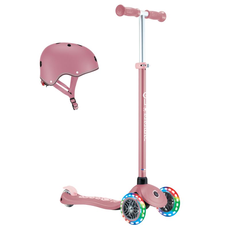 Rosa Kinderroller mit leuchtenden LED-Rädern und passendem pinkem Helm mit schwarzen Lüftungslöchern.