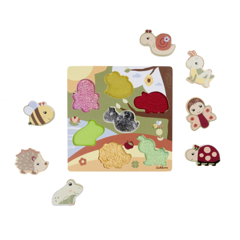 Holzpuzzle mit strukturierten Tierteilen: Biene, Schnecke, Frosch, Hase, Igel, Marienkäfer, Schmetterling. Holzpuzzle mit strukturierten Tierteilen: Biene, Schnecke, Frosch, Hase, Igel, Marienkäfer, Schmetterling.