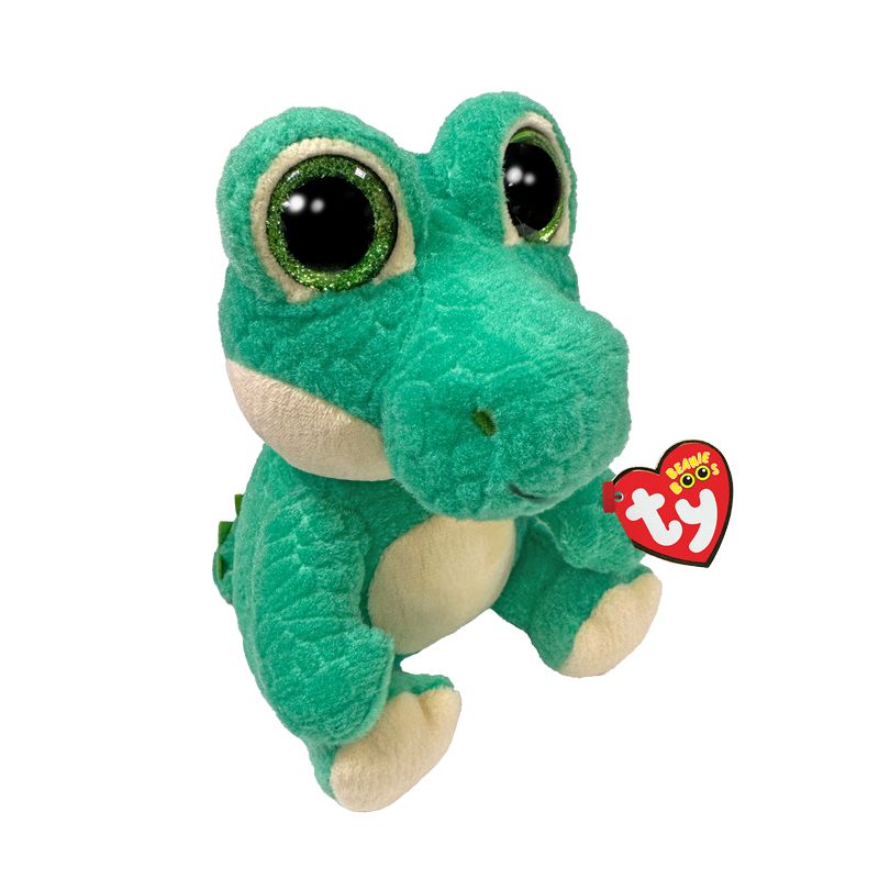 Ein grüner Plüsch-Alligator mit großen Augen und einem Ty Beanie Boos Anhänger an der Hand.