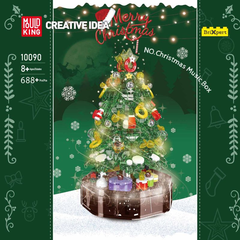 Schachtel eines Bausets mit geschmücktem Weihnachtsbaum, Geschenken und Lichtern vor schneebedecktem Hintergrund.