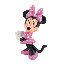 Minnie-Maus-Figur mit rosa gepunktetem Kleid, Schleife und Schuhen steht lächelnd.