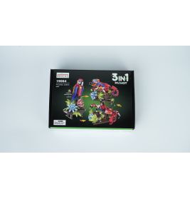 Box eines 3-in-1-Bausatzes für Papagei, Frosch und Libelle vor weißem Hintergrund.