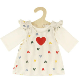 Cremefarbenes Babykleid mit bunten Herzmotiven und großem roten Herz, auf Holzbügel präsentiert.