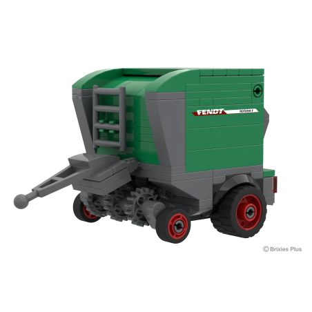 Spielzeugmodell eines grünen und grauen Fendt-Ballers mit roten Rädern, schräg betrachtet.