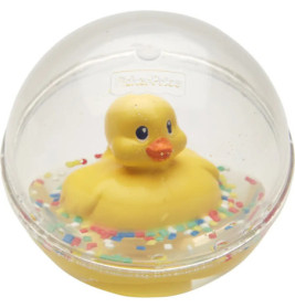 Gelbe Gummiente in einer transparenten Kugel, bunte Streusel am Boden.