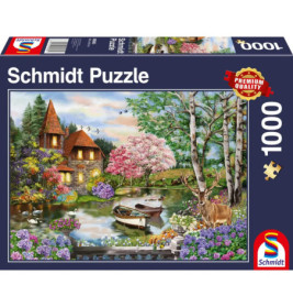 Schmidt Puzzle (1000 Teile): Motiv mit Haus am See, Blumen, Bäumen, einem Reh und einem Boot.
