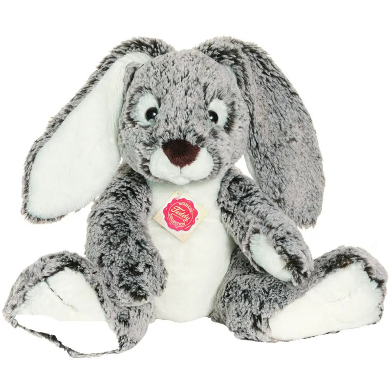 Ein grau-weißes Plüschkaninchen mit Schlappohren und rosa Zieranhänger auf der Brust. Ein grau-weißes Plüschkaninchen mit Schlappohren und rosa Zieranhänger auf der Brust.