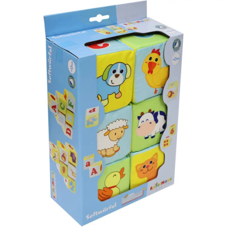 Box mit bunten Stoffbausteinen, jeder mit einem Cartoon-Tiergesicht wie Hund, Huhn, Schaf, Kuh, Ente und Schwein.