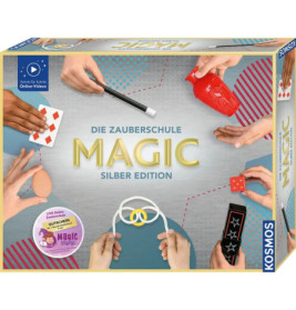 Box der Die Zauberschule Magic Silber Edition, darauf Hände, die verschiedene Zaubertricks vorführen.
