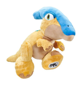 Gelbes Dinosaurier-Plüschtier mit blauem Kamm sitzt aufrecht vor weißem Hintergrund.