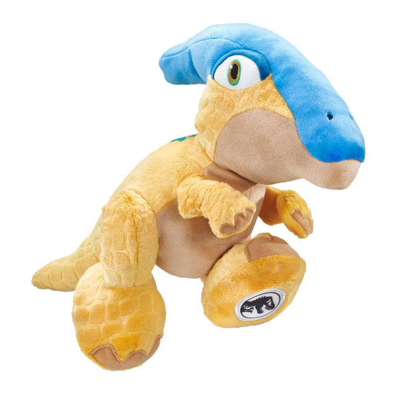 Gelbes Dinosaurier-Plüschtier mit blauem Kamm sitzt aufrecht vor weißem Hintergrund. Gelbes Dinosaurier-Plüschtier mit blauem Kamm sitzt aufrecht vor weißem Hintergrund.