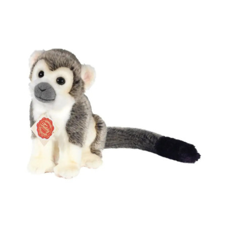 Grauer Plüschaffe mit langem Schwanz sitzt aufrecht und trägt ein rotes Schild auf der Brust.