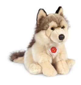 Plüsch-Wolf mit grauem und beigem Fell, schwarzen Ohrenspitzen und einem rot-weißen Etikett am Hals.