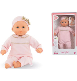 Babypuppe im rosa Outfit und Mütze mit goldener Schleife, sitzend und in Corolle-Verpackung abgebildet.