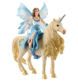 Eine Elfenfigur mit blauen Flügeln reitet auf einem goldenen, funkelnden Einhorn.