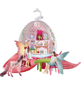 Feen-Spielset mit zwei Puppen, pinkem Einhorn und farbenfrohem, geöffnetem Haus in Ei-Form.