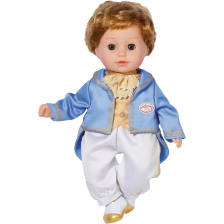 Puppe mit kurzen braunen Haaren im blau-goldenen Prinzenoutfit und weißer Hose vor weißem Hintergrund.