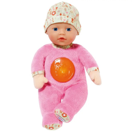 Babypuppe in rosa Outfit und gemusterter Mütze, mit orangefarbenem Licht am Bauch. Babypuppe in rosa Outfit und gemusterter Mütze, mit orangefarbenem Licht am Bauch.