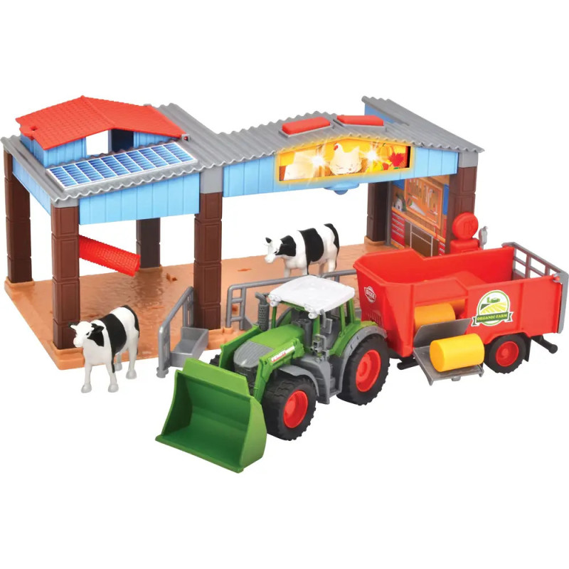 Spielzeug-Bauernhof mit Scheune, zwei Kühen, grünem Traktor und rotem Anhänger mit Heuballen. Spielzeug-Bauernhof mit Scheune, zwei Kühen, grünem Traktor und rotem Anhänger mit Heuballen.