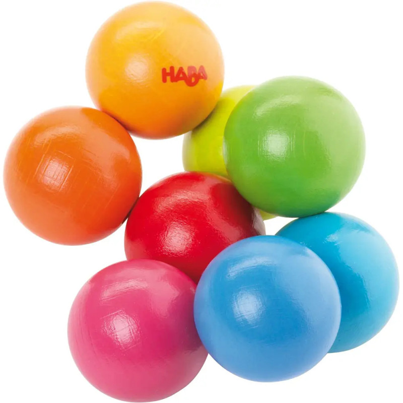 Acht bunte Holzkugeln, darunter Rot, Orange, Gelb, Grün, Blau und Pink, liegen eng beieinander. Acht bunte Holzkugeln, darunter Rot, Orange, Gelb, Grün, Blau und Pink, liegen eng beieinander.