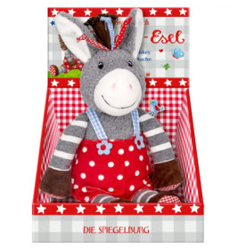 Plüsch-Esel mit gestreiftem Shirt und roten Pünktchen-Overalls sitzt in einer rot gemusterten Sterneschachtel.