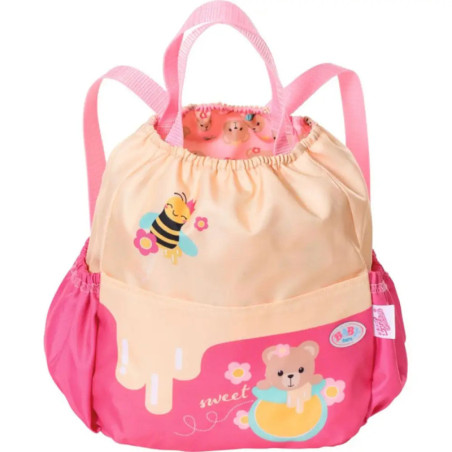 Rosa-gelber Rucksack mit Bienen-, Bären- und Blumenmotiv sowie Kordelzug und Griffen.