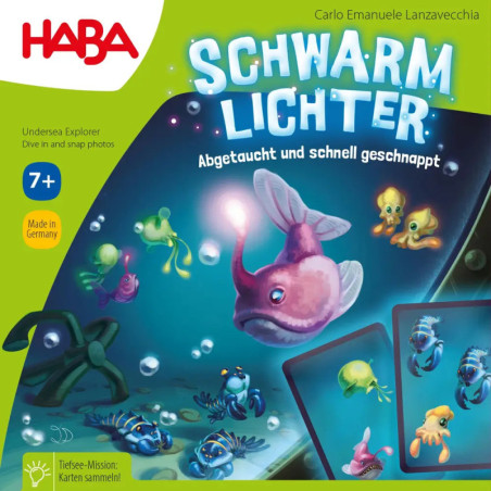 Bunte Brettspielbox mit Cartoon-Meerestieren, Karten und dem Titel Schwarm Lichter auf grünem Hintergrund. Bunte Brettspielbox mit Cartoon-Meerestieren, Karten und dem Titel Schwarm Lichter auf grünem Hintergrund.