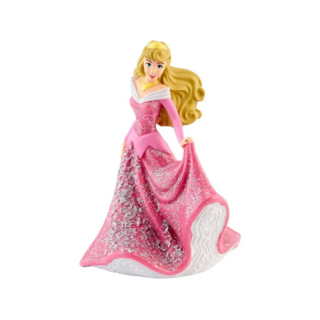 Eine Prinzessinnenfigur mit blondem Haar im pink glitzernden Kleid steht vor weißem Hintergrund.