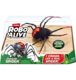 Das Robo Alive Crawling Spider Spielzeug mit roten Markierungen leuchtet in seiner Verpackung im Dunkeln.