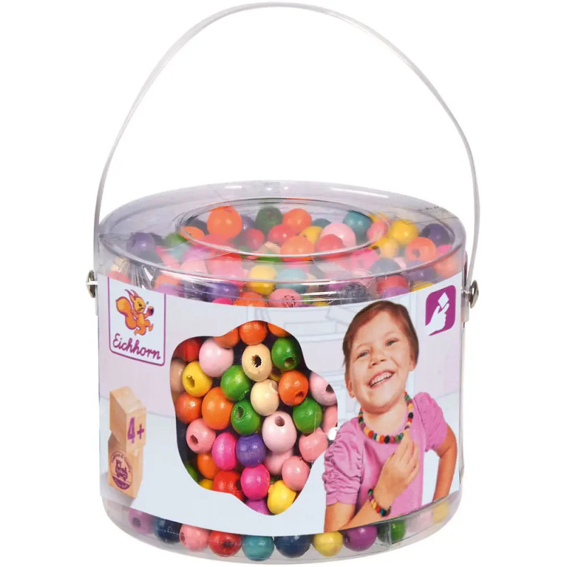 Klare Plastikdose mit bunten Perlen, Etikett zeigt lachendes Kind. Für Kinder ab 4 Jahren geeignet.